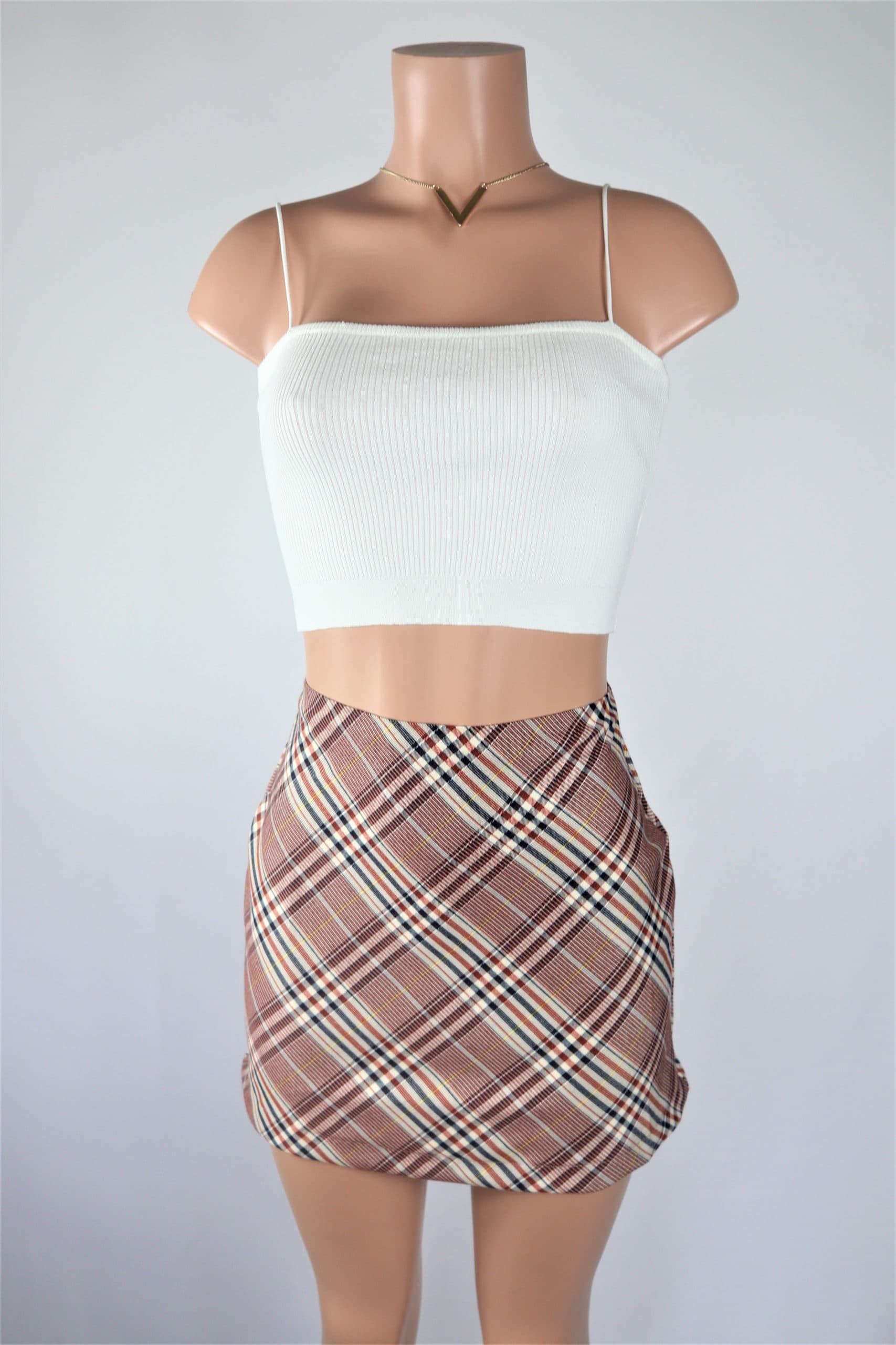 Bridget Plaid Skirt High waisted plaid ALine mini skirt with slit.
